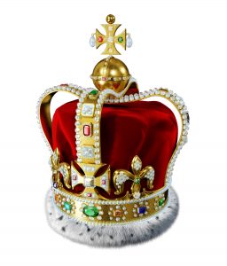 Royal gold crown, with many jewels, decorations and ermine fur, isolated on white background. Clipping path included.